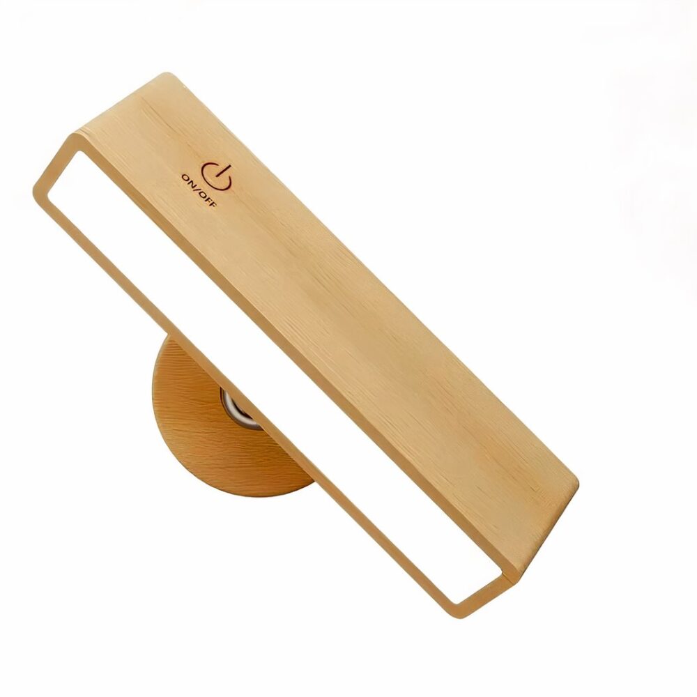 Lámpara de lectura de pared con base redonda de color madera y rectángulo iluminado de color madera con símbolo de encendido/apagado en la parte superior. Fondo blanco.